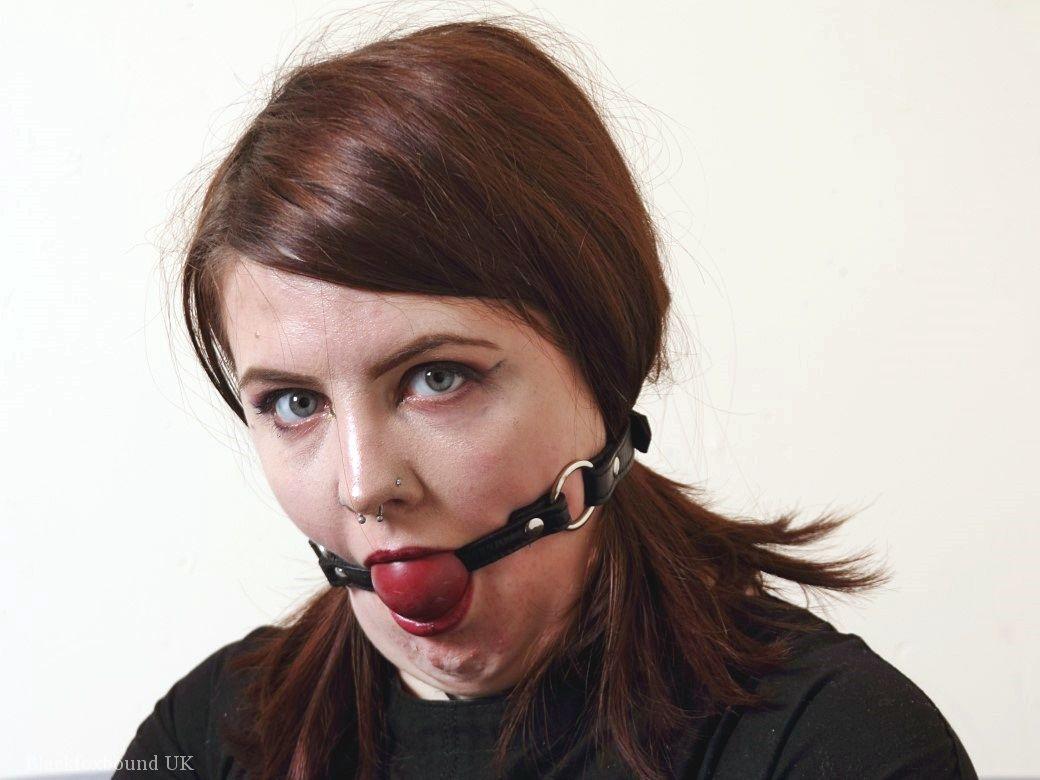 Tattooed redhead Luna La Roux sports a ball gag while restrained with straps porn photo #425569548