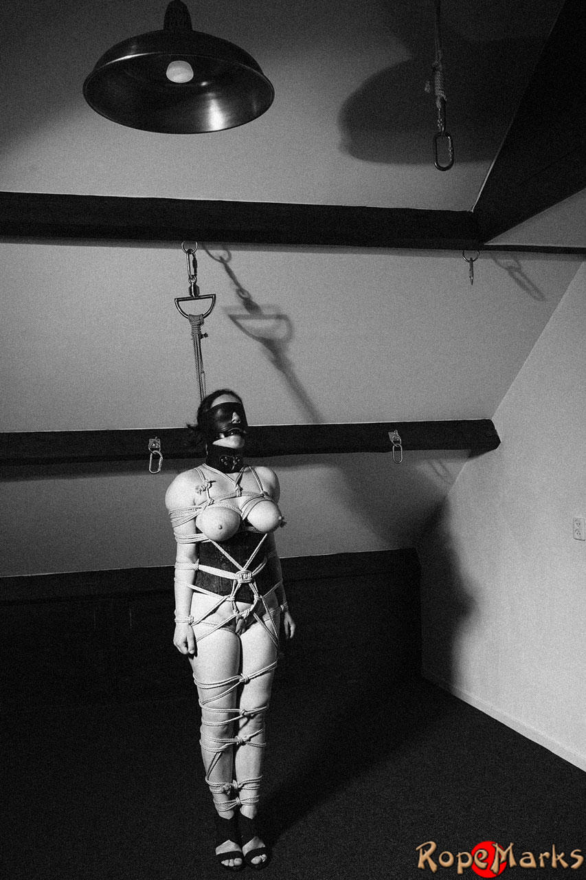 Hooded model Amely is tied and suspended by ropes in an attic setting porn photo #424921112 | Club RopeMarks Pics, Amely, Bondage, mobile porn