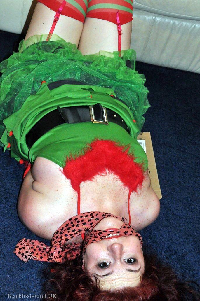 Busty redhead is restrained and gagged in Christmas outfits photo porno #423178121
