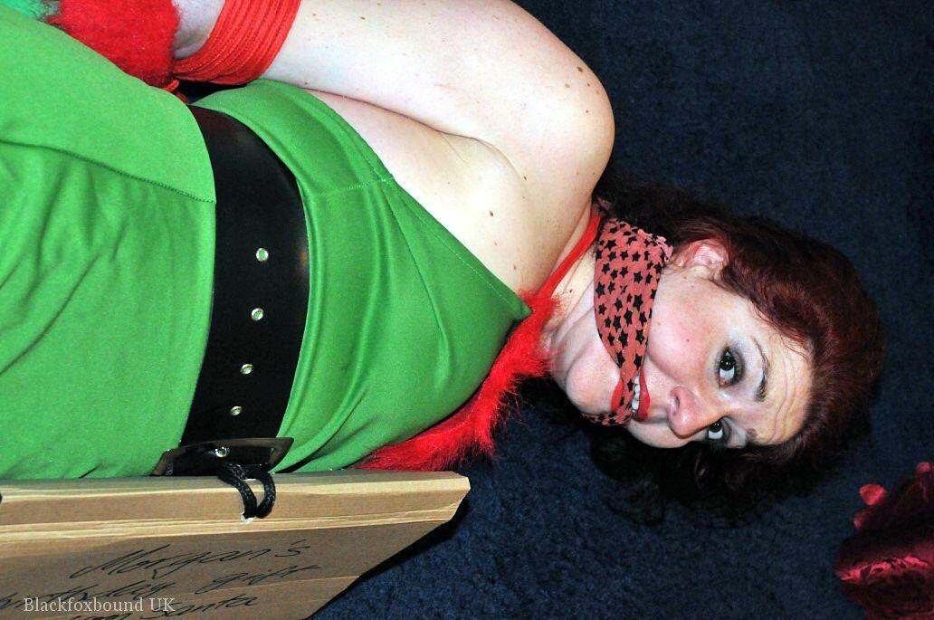 Busty redhead is restrained and gagged in Christmas outfits porno foto #423178137