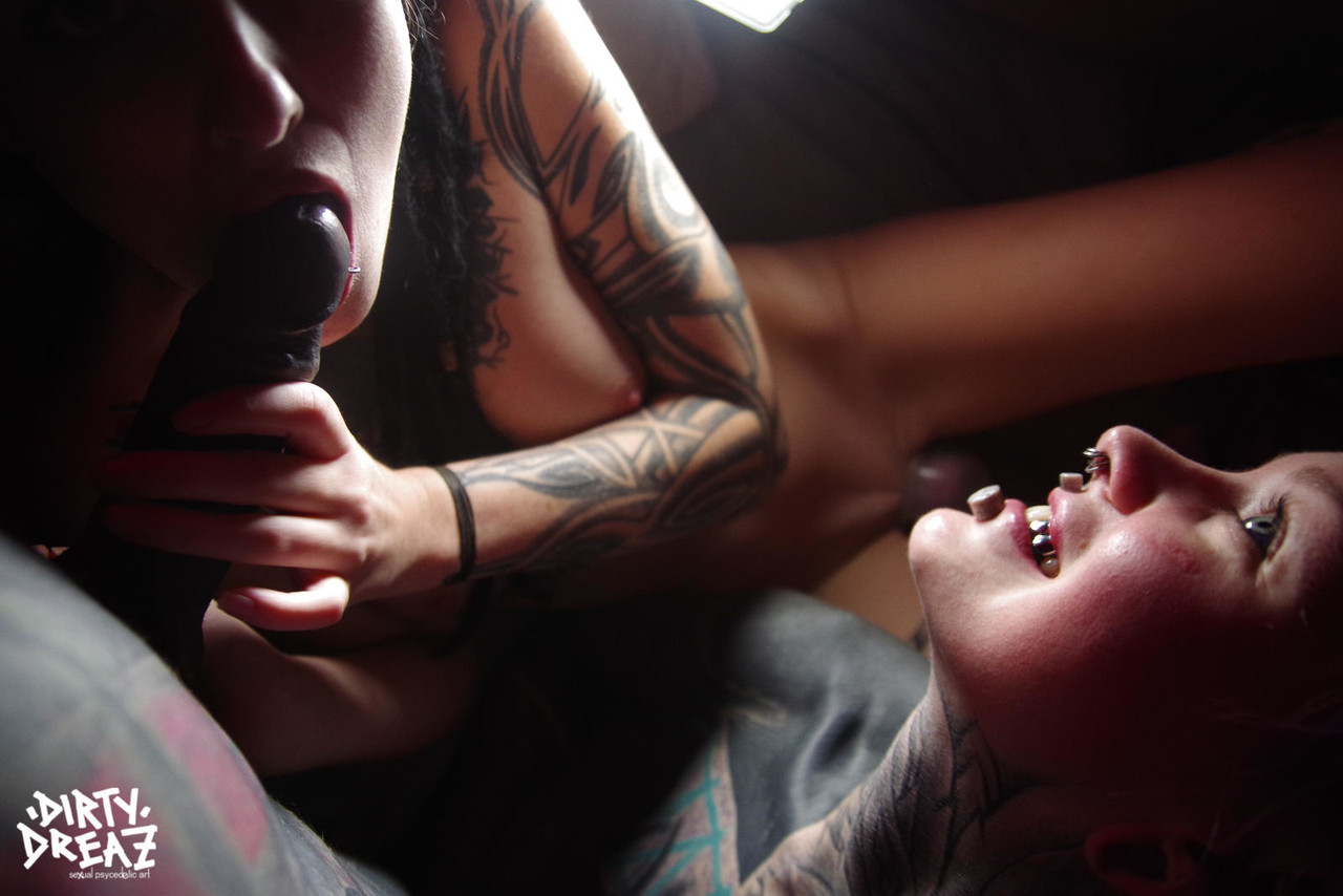 Three alternative girls share a tattooed penis during close up action porn photo #428792189