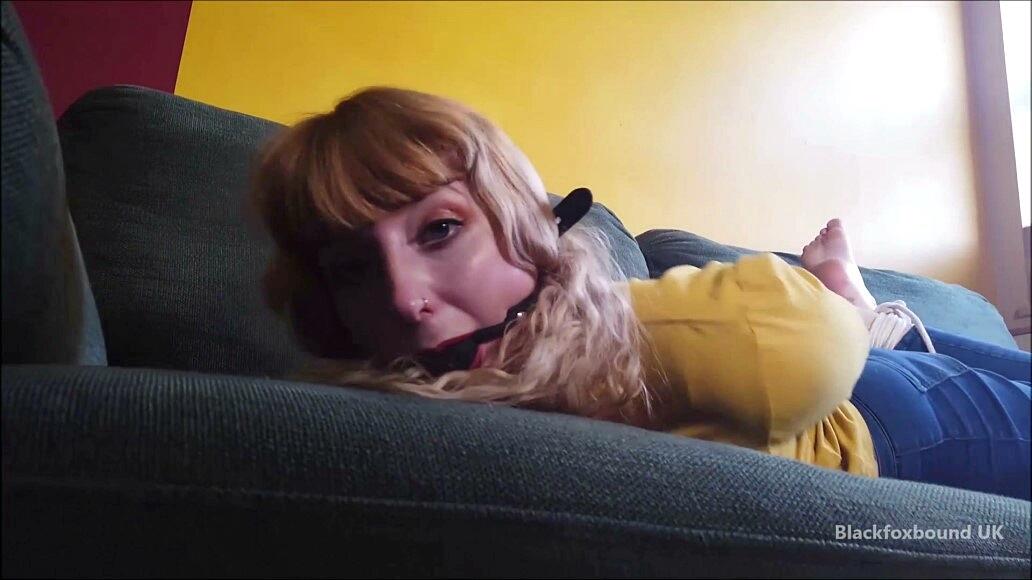 Barefoot white girl is hogtied on a sofa while ball gagged in her clothing porno fotoğrafı #425132915