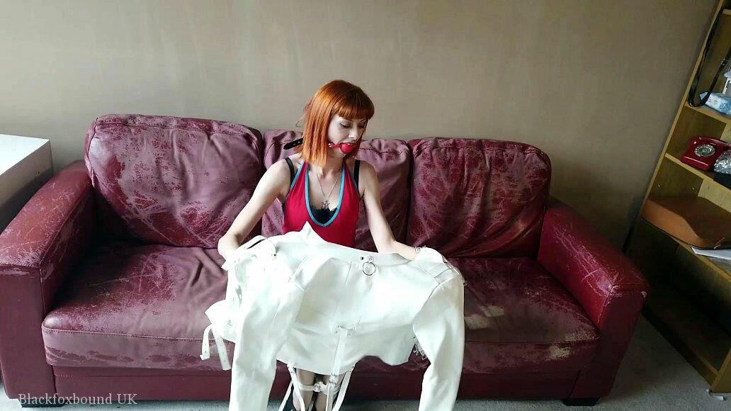 Natural redhead sports a ball gag while restrained with a straitjacket porn photo #425674746