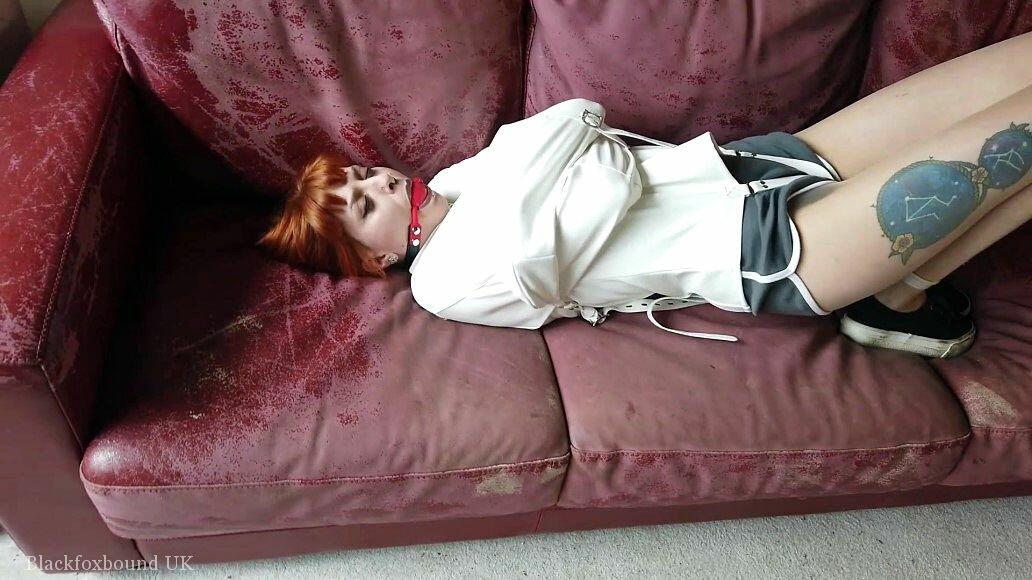 Natural redhead sports a ball gag while restrained with a straitjacket foto pornográfica #425513754