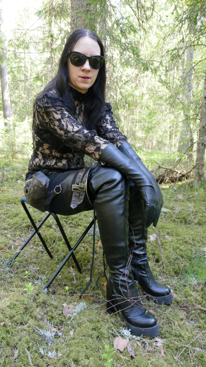 Clothed female wears leather gloves and boots plus shades in the woods foto porno #427309988