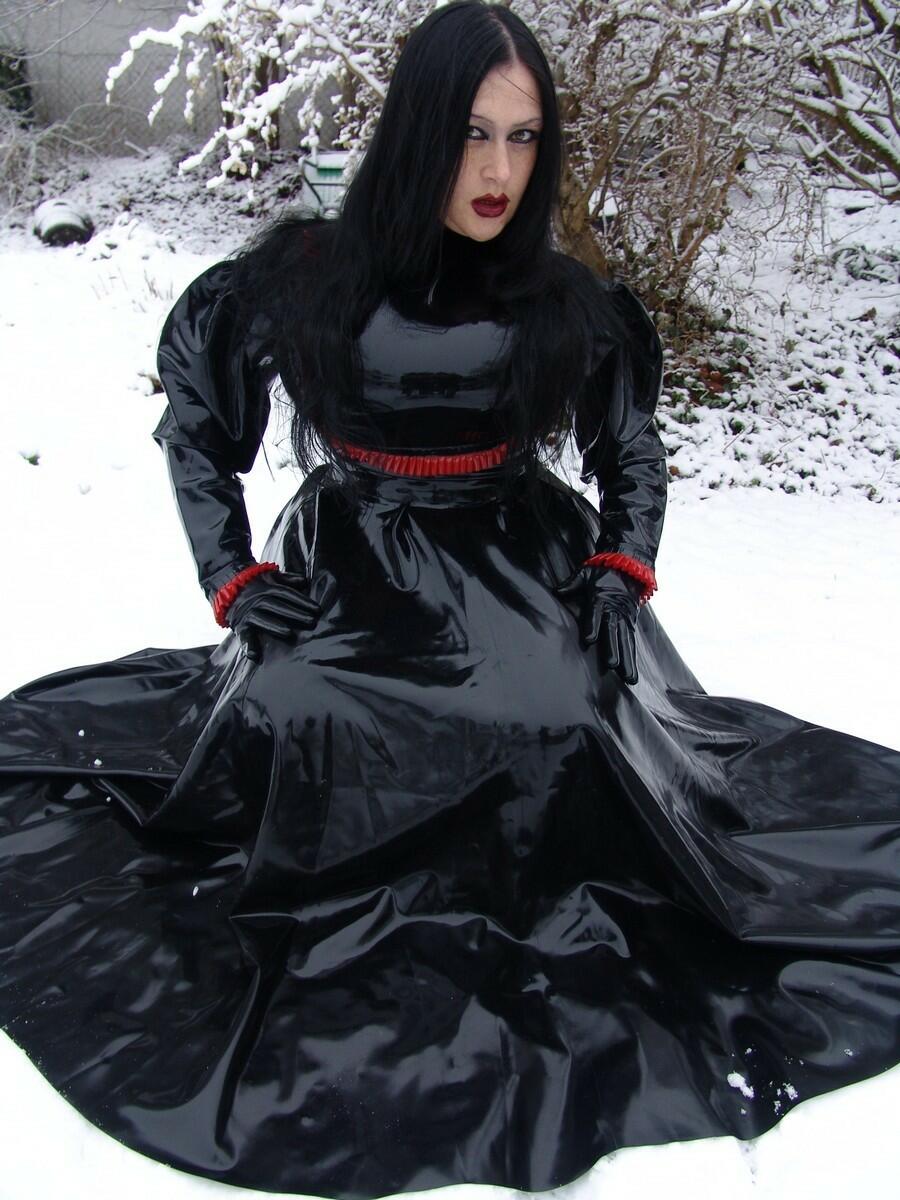 Goth woman Lady Angelina models a black latex dress on snow-covered ground ポルノ写真 #423838482
