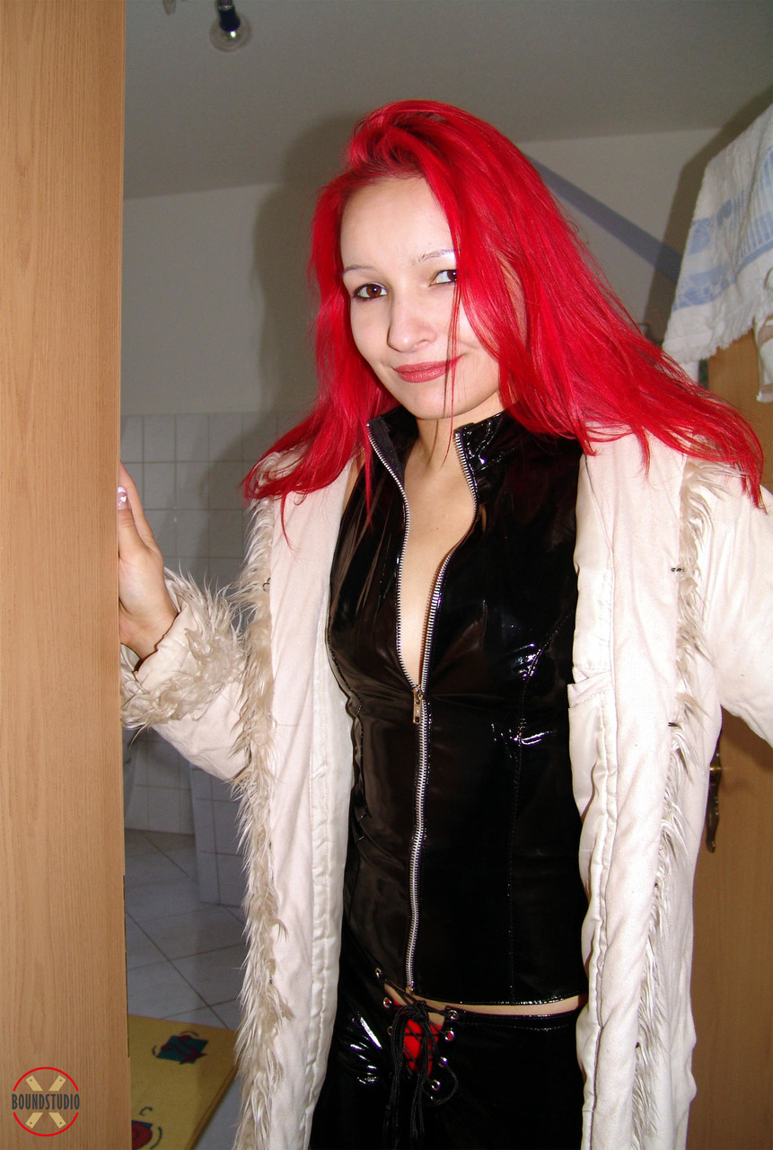 Solo girl with dyed hair Tkbaby practices self bondage in a home dungeon