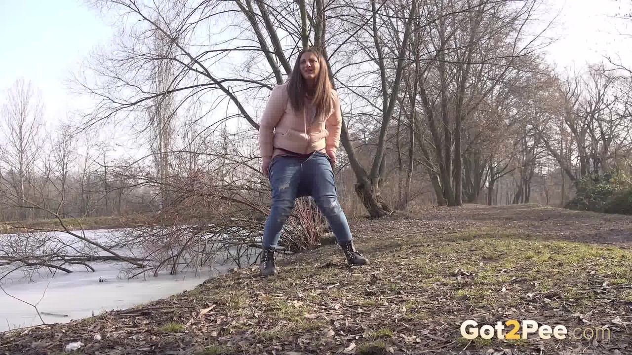 Nicolette Noir squats to piss by a lake outside porn photo #425154750