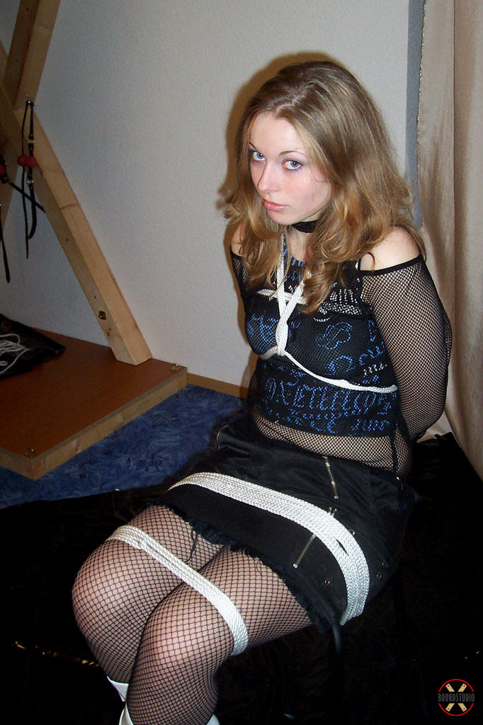 Solo model is tied up with rope while fully clothed in white boots foto porno #425303713