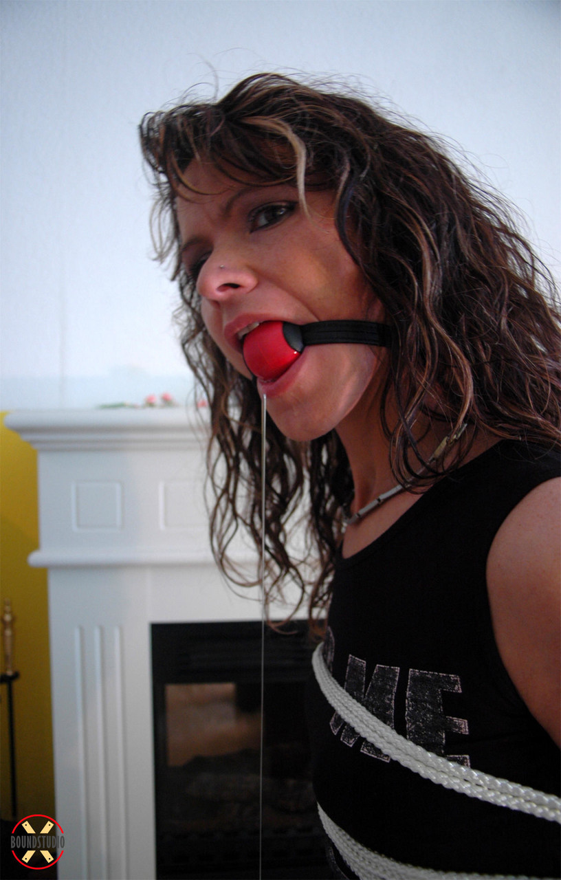 Clothed female drools while ball gagged with her arms tied behind her back porno foto #426926816