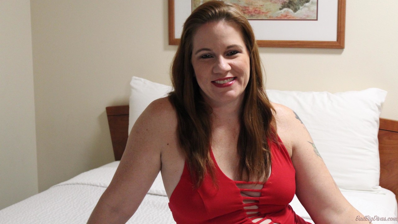 Redheaded Plumper Ginger Reigh Displays Her Painted Toenails In A Red Dress