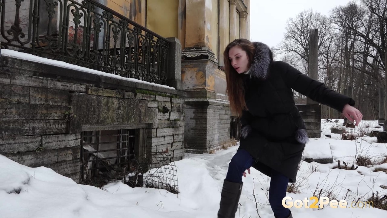 Clothed redhead Vika squats for a pee on the snow-covered steps of a church zdjęcie porno #428437813