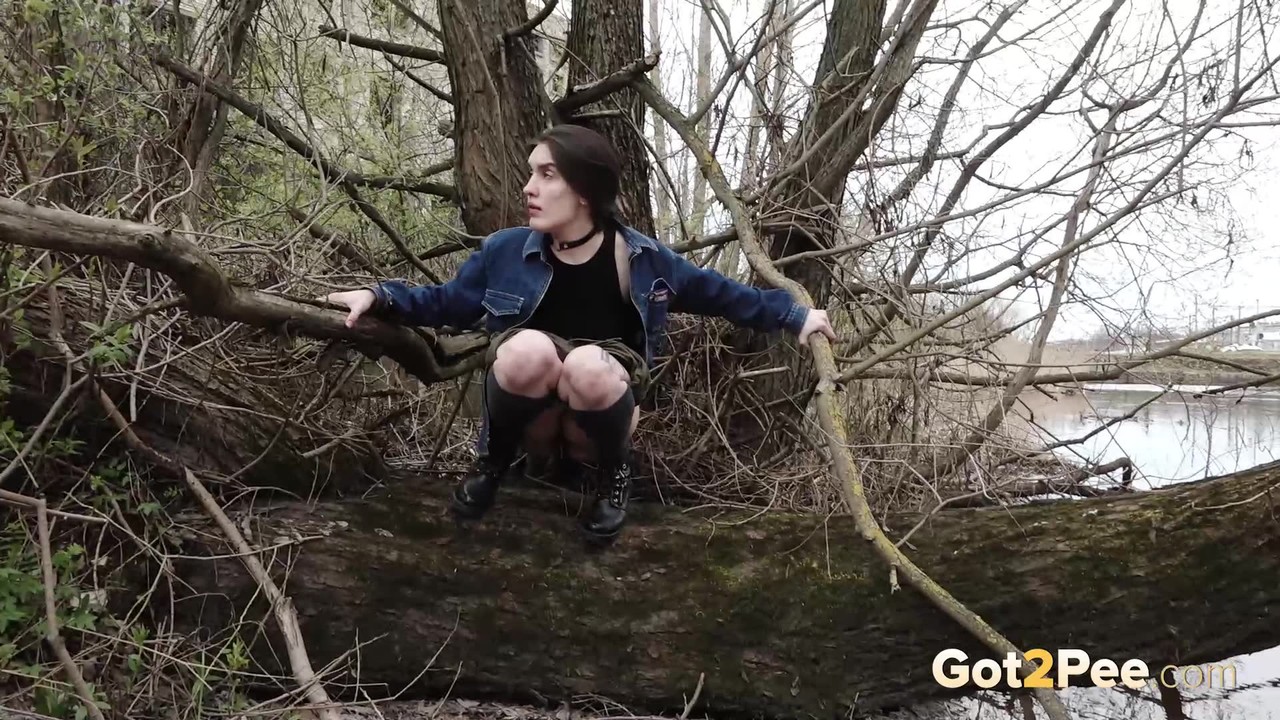 Distressed girl ventures out onto a tree branch for a badly needed pee porno fotoğrafı #428816093