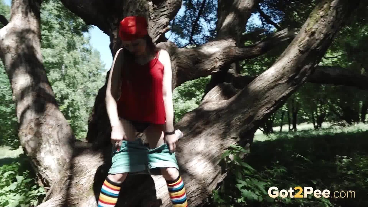 Young blonde Larisa takes a pee behind a tree in multi-coloured knee socks zdjęcie porno #426396407