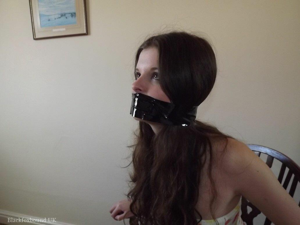 Clothed girl Tamara looks in a mirror while gagged and restrained to a chair foto porno #422923012