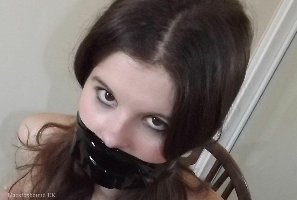 Clothed girl Tamara looks in a mirror while gagged and restrained to a chair foto porno #423821475