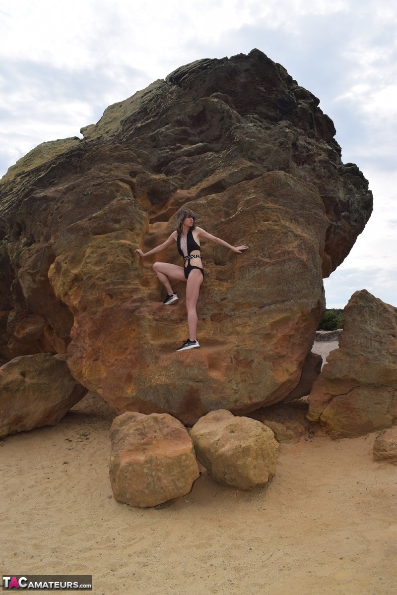 Amateur model gets naked in high-heeled footwear on iron ladened rocks foto porno #428560048