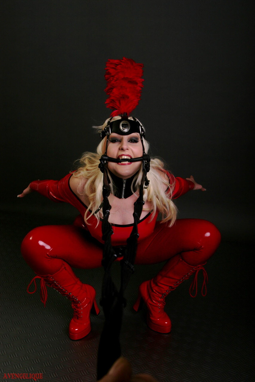 Blonde female models a red latex ponygirl outfit during a non-nude session Porno-Foto #426096736