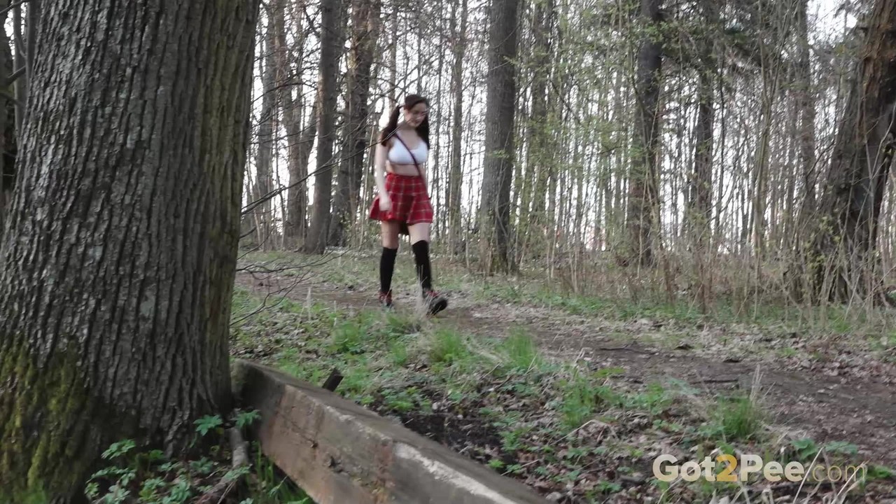 Solo girl Alexa hikes up her skirt before taking a pee during a walk in woods foto porno #428779629