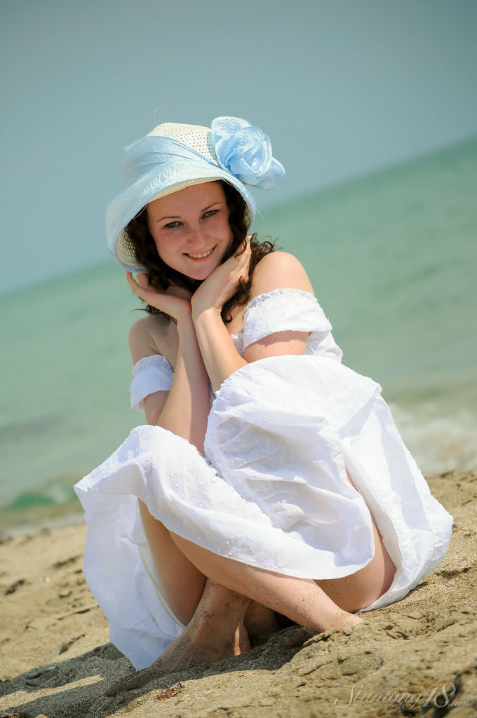 Charming 18-year-old Christina F gets completely naked on a sandy beach foto porno #429015174