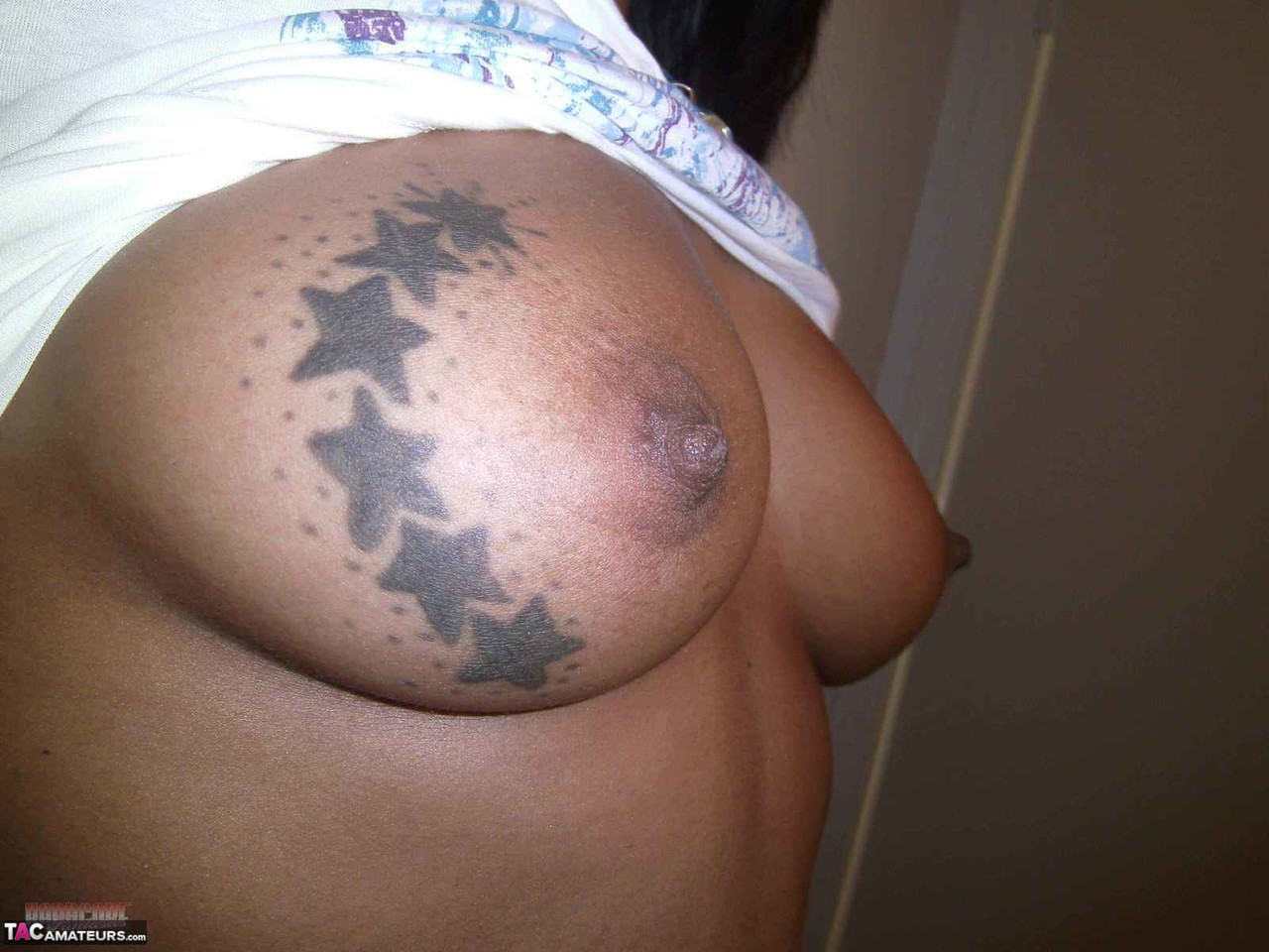 Ebony Amateur Takes Self Shots Of Her Big Tattooed Boobs And Bald Vagina