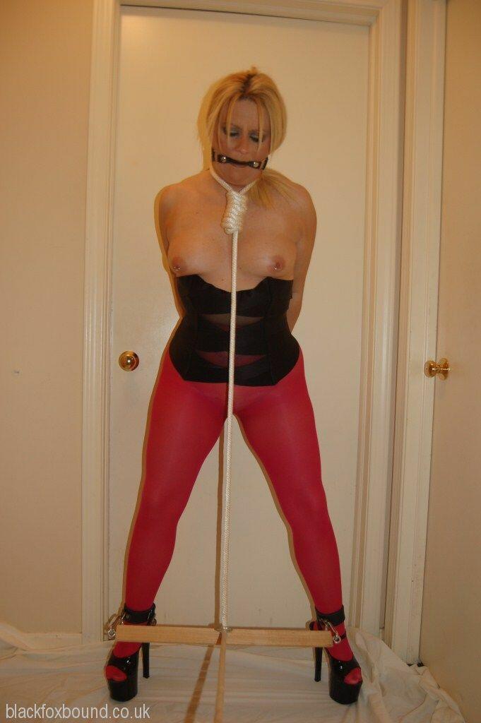Blonde Chick Displays Her Boobs While Ball Gagged And Restrained In Pantyhose