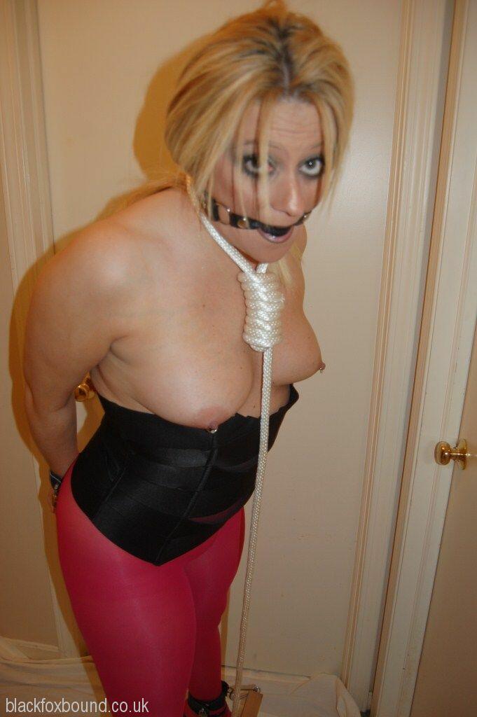 Blonde Chick Displays Her Boobs While Ball Gagged And Restrained In Pantyhose