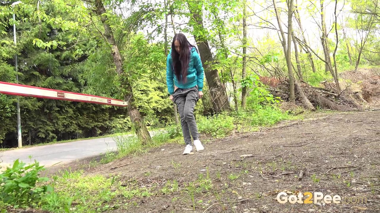 Short taken girl squats to be on a path in the woods while wearing a coat photo porno #428632587