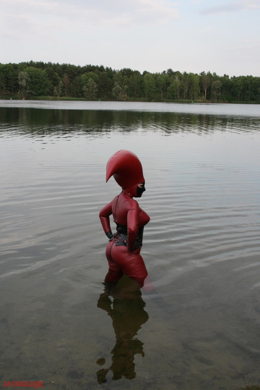 Fetish model Avengelique wades into a body of water in a rubber costume foto porno #427876371