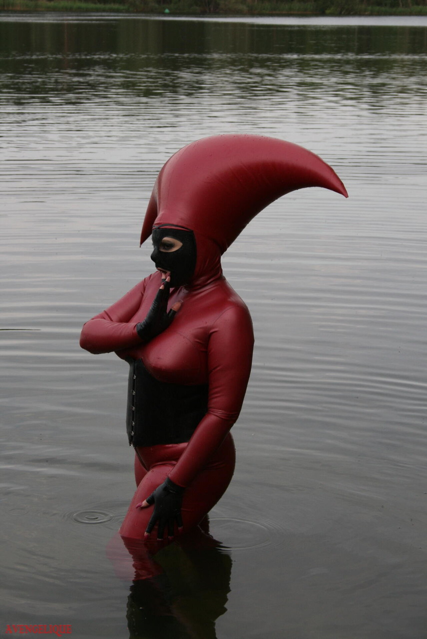 Fetish model Avengelique wades into a body of water in a rubber costume porn photo #427876412 | Rubber Tits Pics, Avengelique, Latex, mobile porn