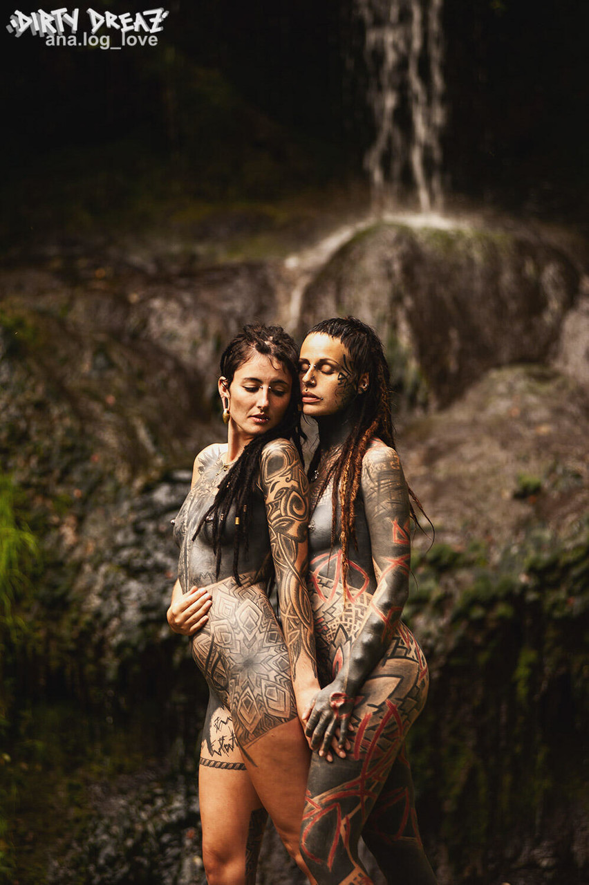Heavily tattooed lesbians hold each other while totally naked on a bridge porn photo #423468074
