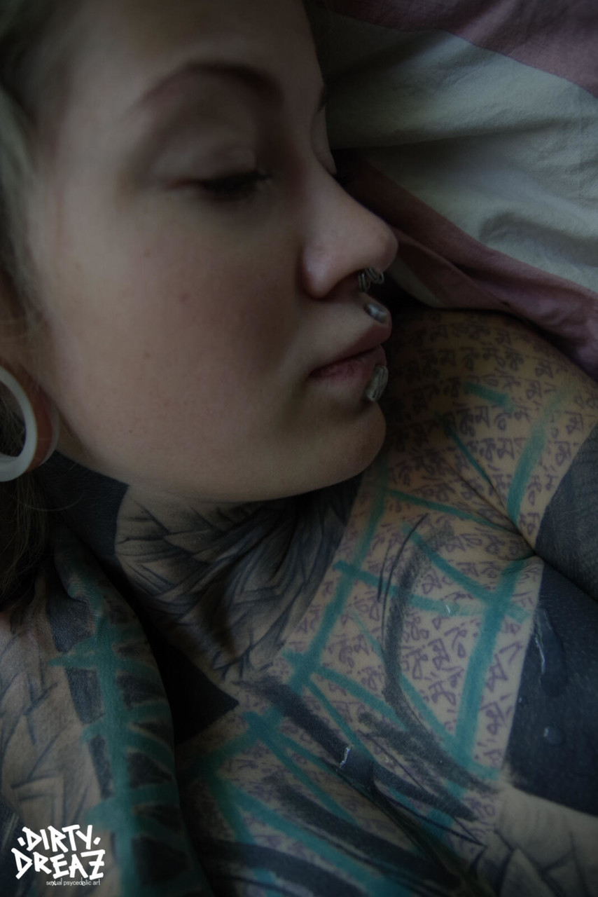 Heavily tattooed girl Valkyriz sports dreadlocks while fingering her pussy porn photo #423838557