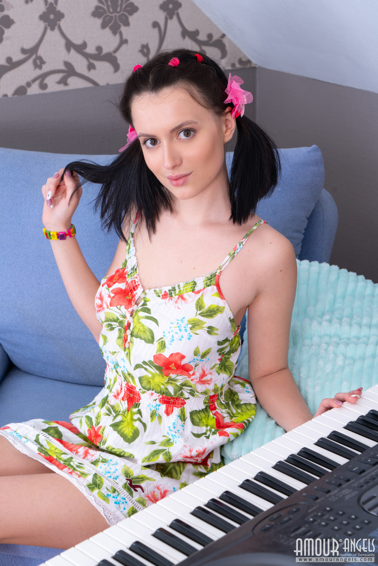 Young looking girl Minnie gets naked in pigtails while playing a keyboard foto porno #426880439