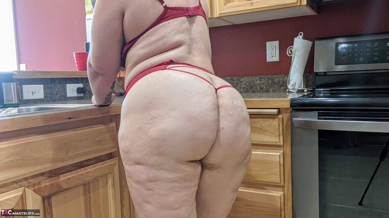 Amateur woman Busty Kris Ann shows her big tits and butt in her kitchen porn photo #422697604