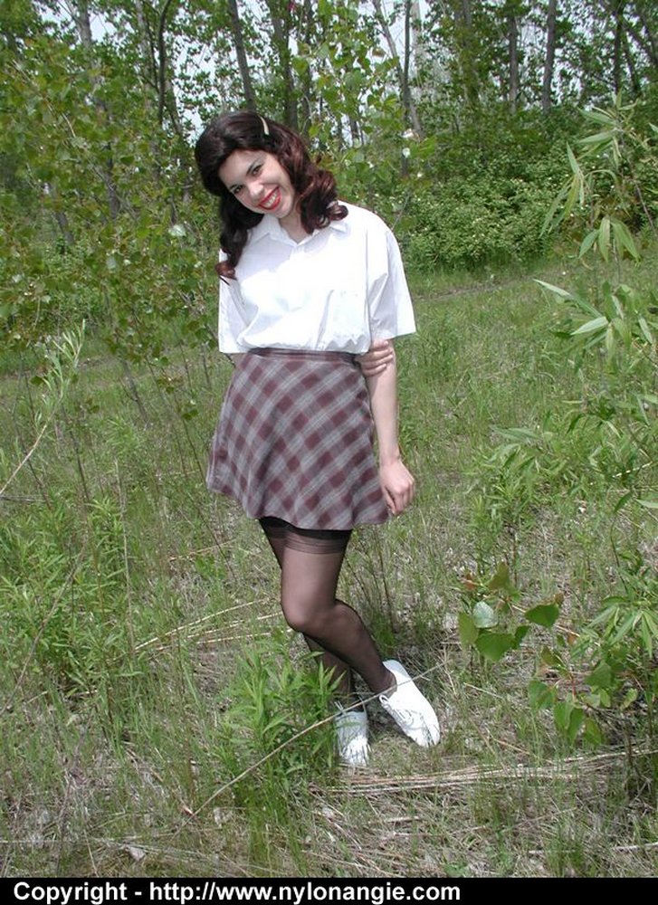 Amateur girl doffs retro clothes while wearing nylons in a field foto porno #428838431
