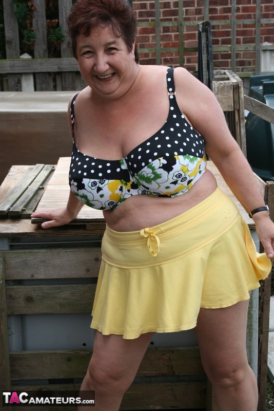 Thick older woman Kinky Carol models a bikini on patio stones porn photo #427220741