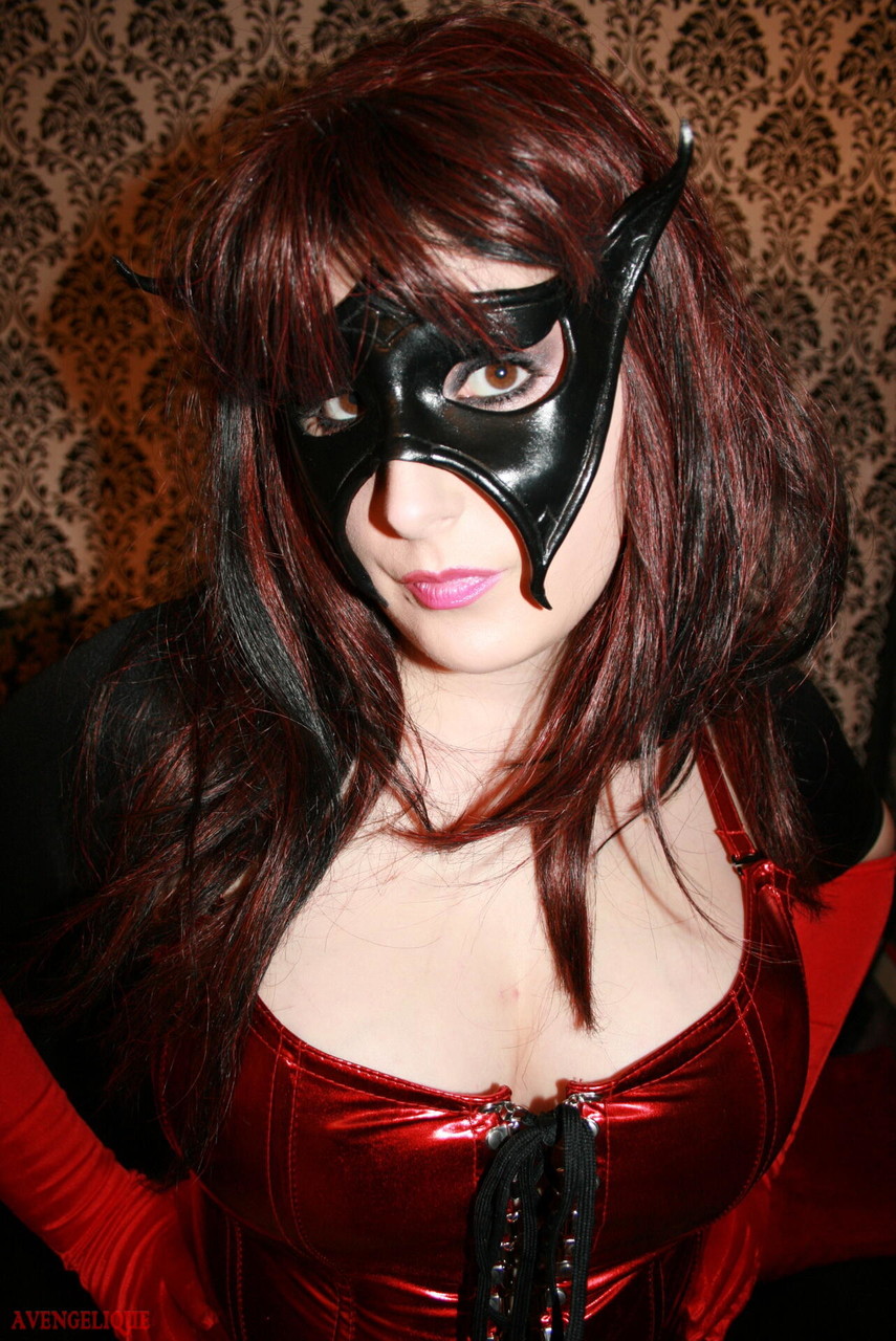Redheaded girl Avengelique sports a mask while modelling rubber wear porn photo #424923786