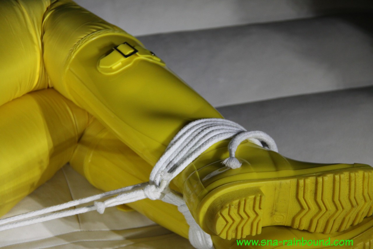 Caucasian chick Pia is ball gagged and hogtied in a yellow rain suit foto porno #426607367
