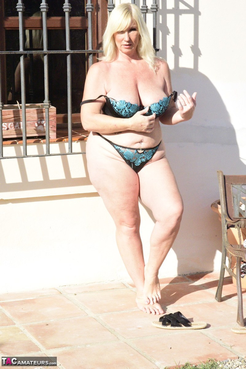 Older blonde Melody cradles her boobs after baring her overweight body zdjęcie porno #422686294