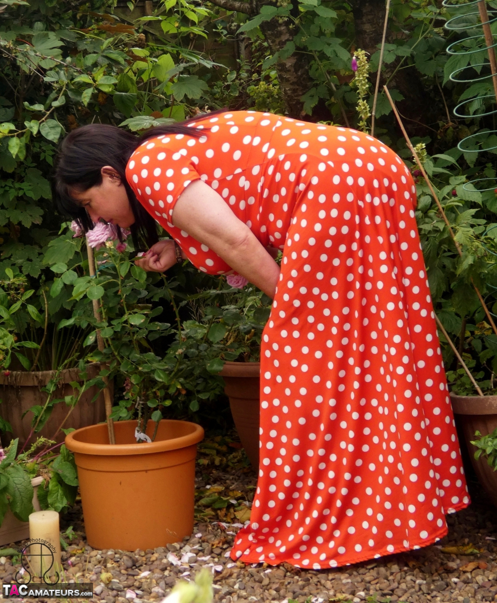 While tending to her garden plants, Juicey Janey, an amateur gardener from the UK, bares herself.