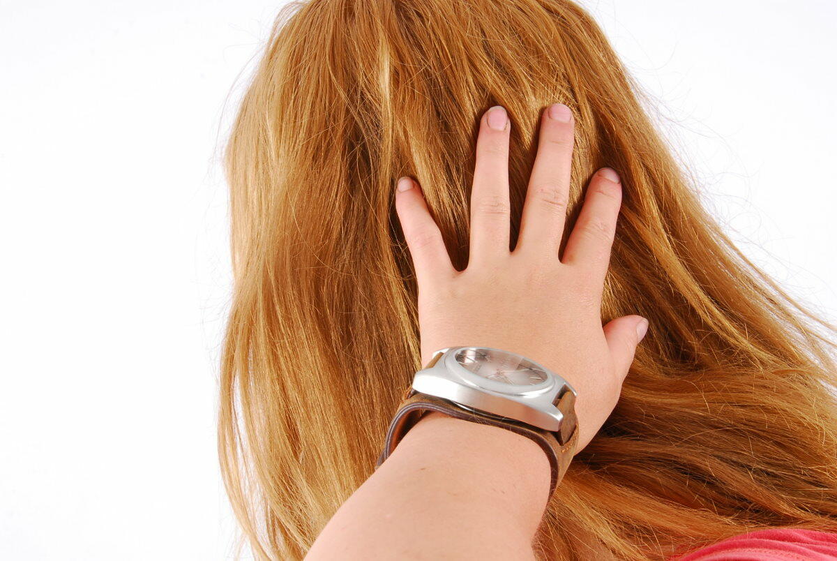 Natural Redhead Judy Displays Her Huge Oozoo Cuff Watch While Fully Clothed