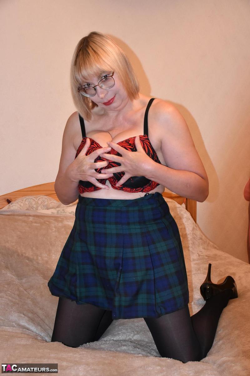 Mature blonde Barby Slut pulls down her hose after removing schoolgirl clothes foto porno #428141767