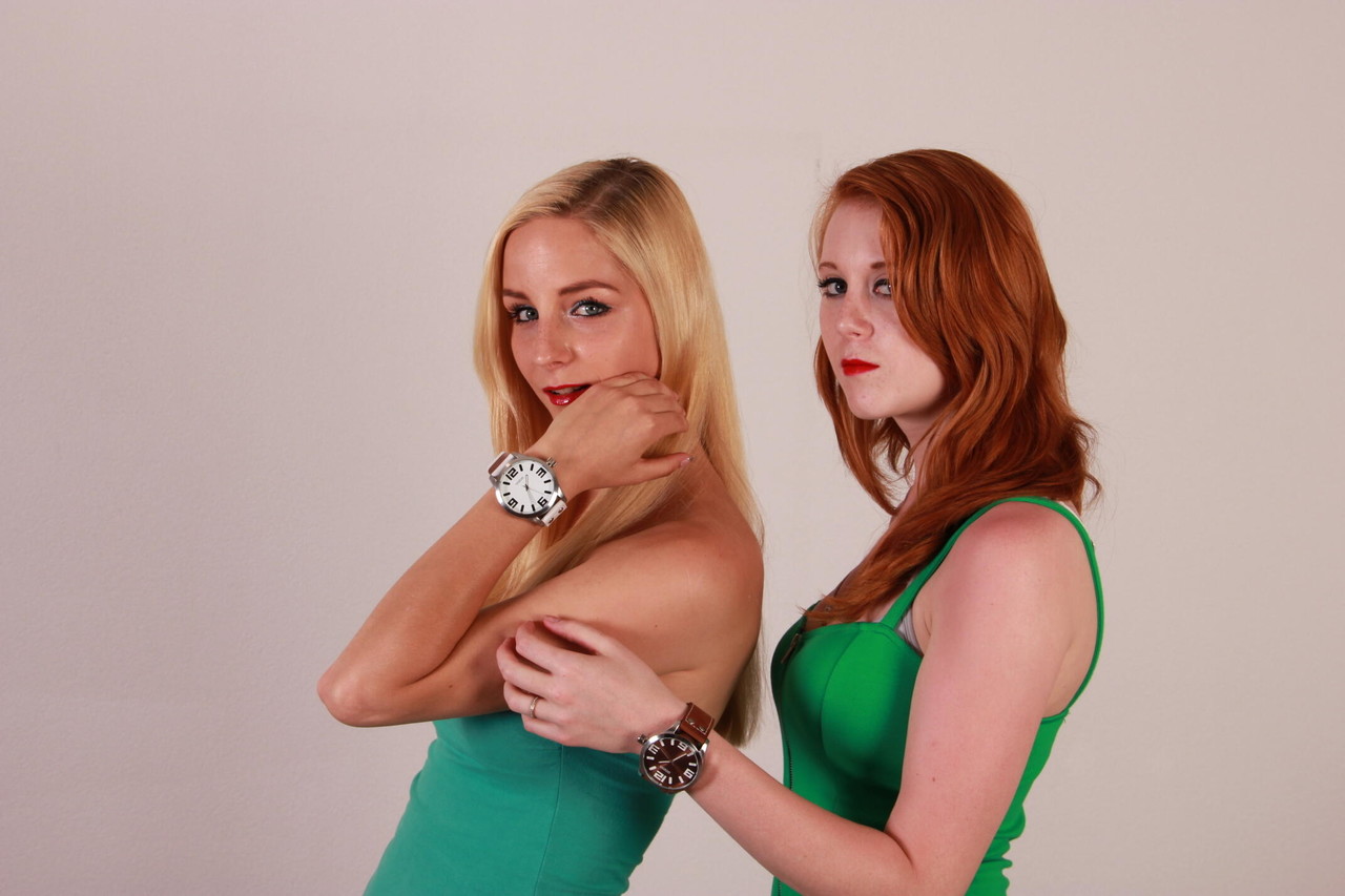 Lesbian girls Eva and Amanda display their Oozoo watches while fully clothed porn photo #425113330