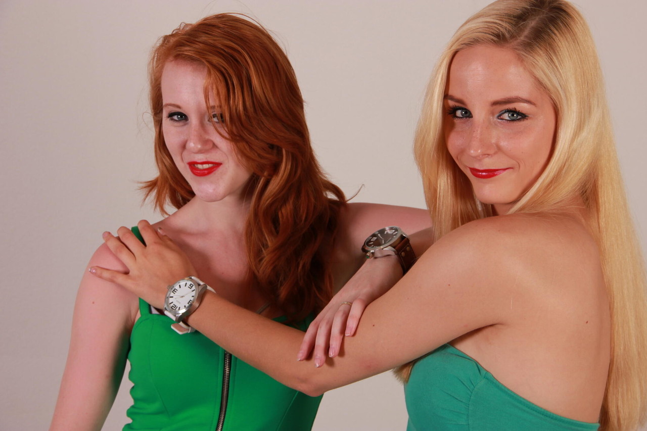 Lesbian girls Eva and Amanda display their Oozoo watches while fully clothed porn photo #425113332
