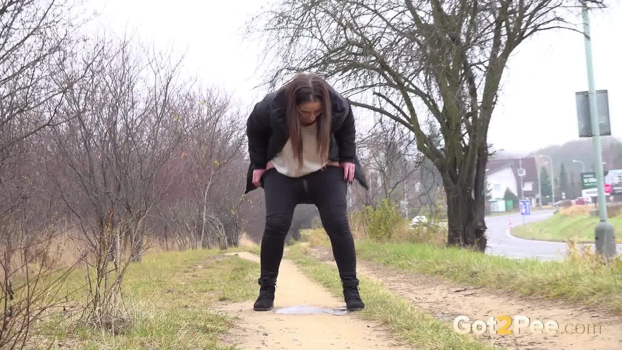 Nicolette Noir squats for a badly needed pee while walking on a dirt path porn photo #426315477
