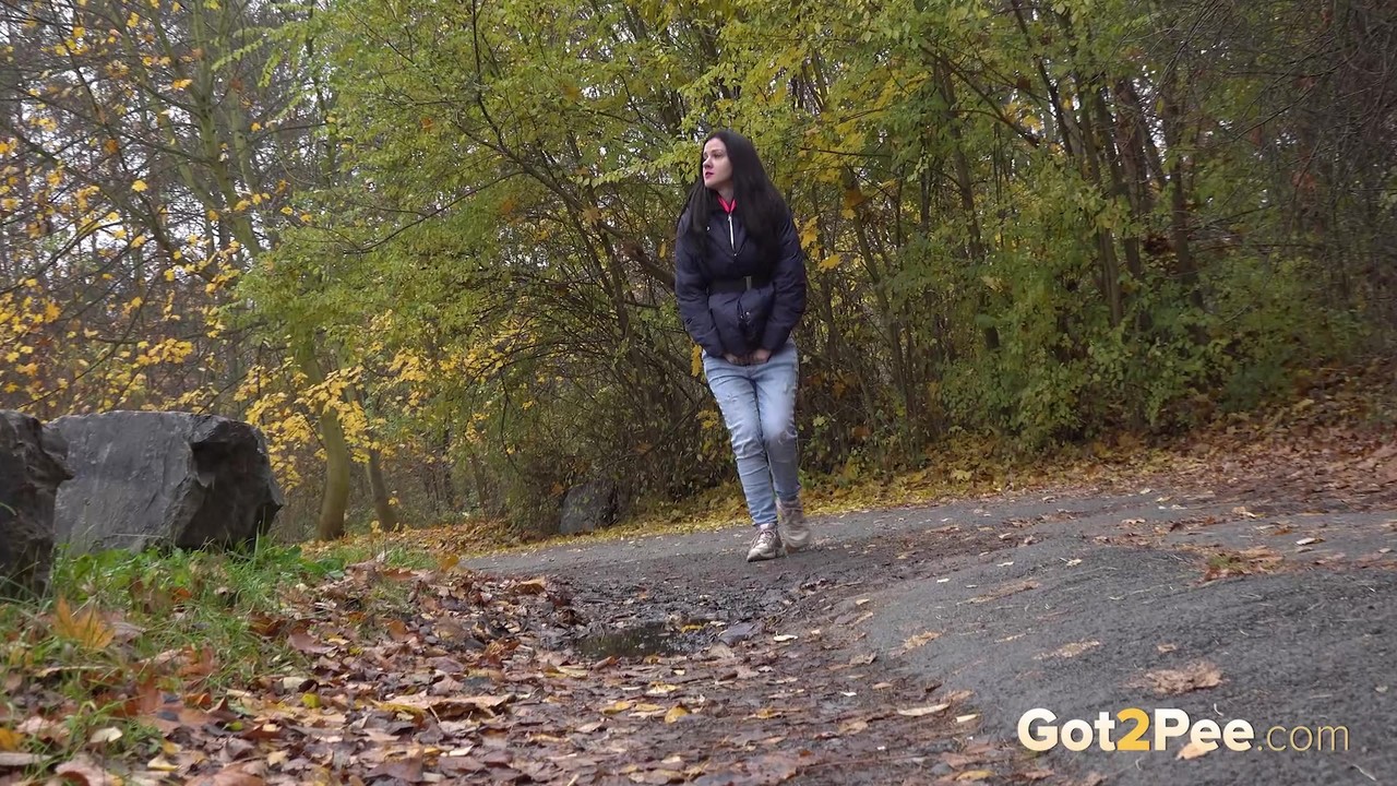 Dark-haired girl pulls down her jeans to take a piss while out for a walk foto porno #424099433