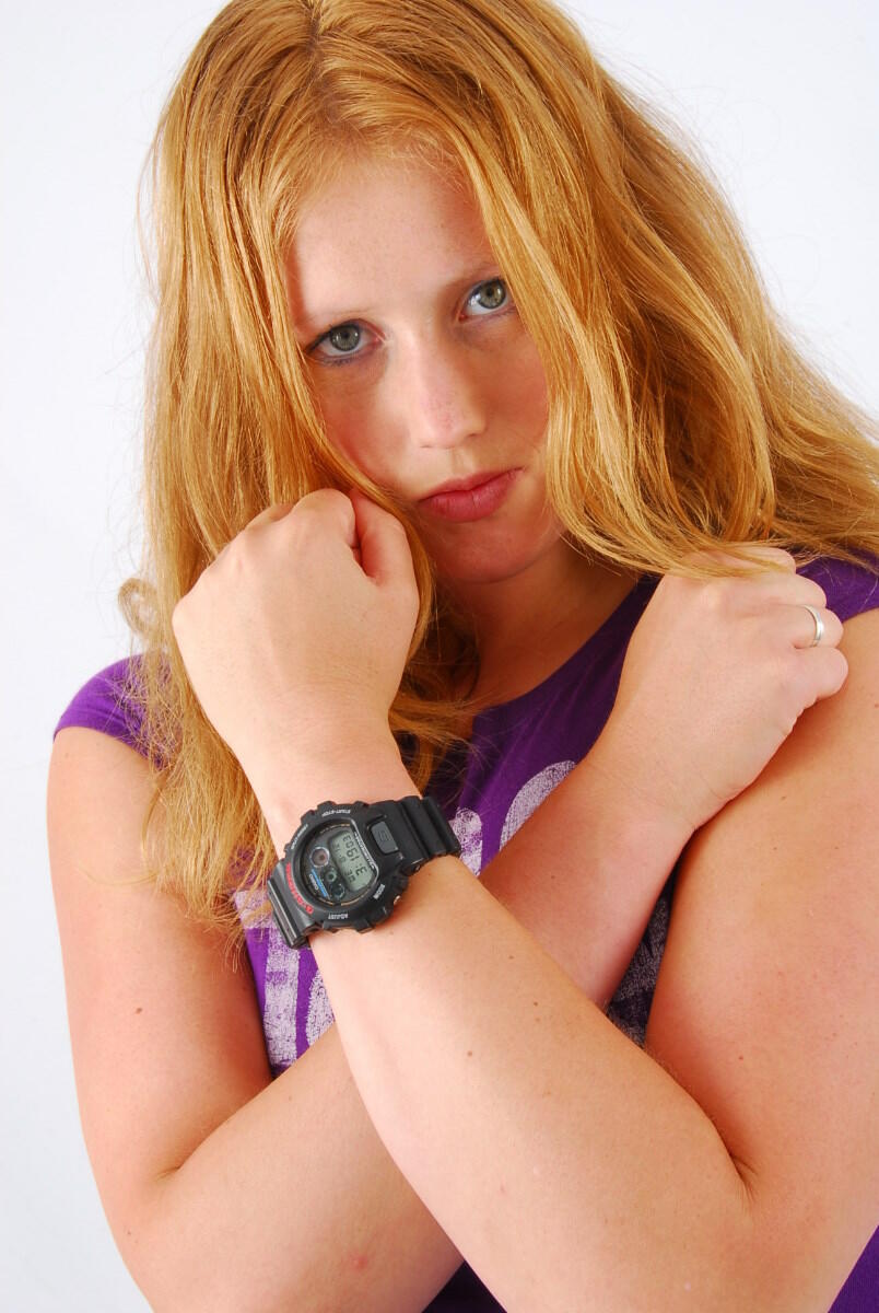 Natural redhead Judy models a black G-Shock watch while fully clothed porn photo #425367498