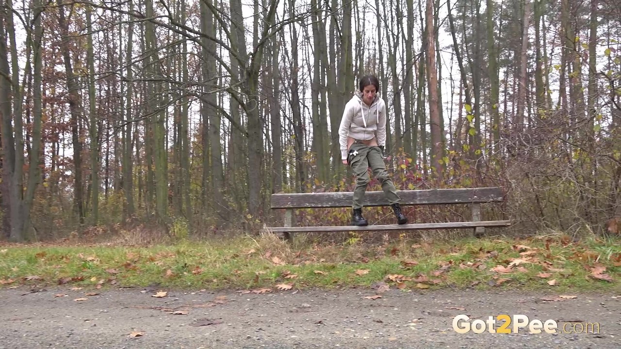 Caucasian girl Ali Bordeaux takes an urgent piss on a bench in the woods porn photo #426390922