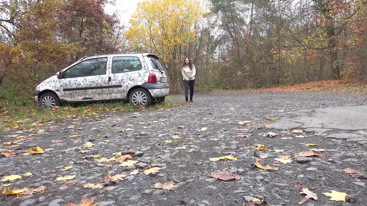 White girl Nicolette Noir takes a piss beside a parked car in a wooded setting foto porno #427213955