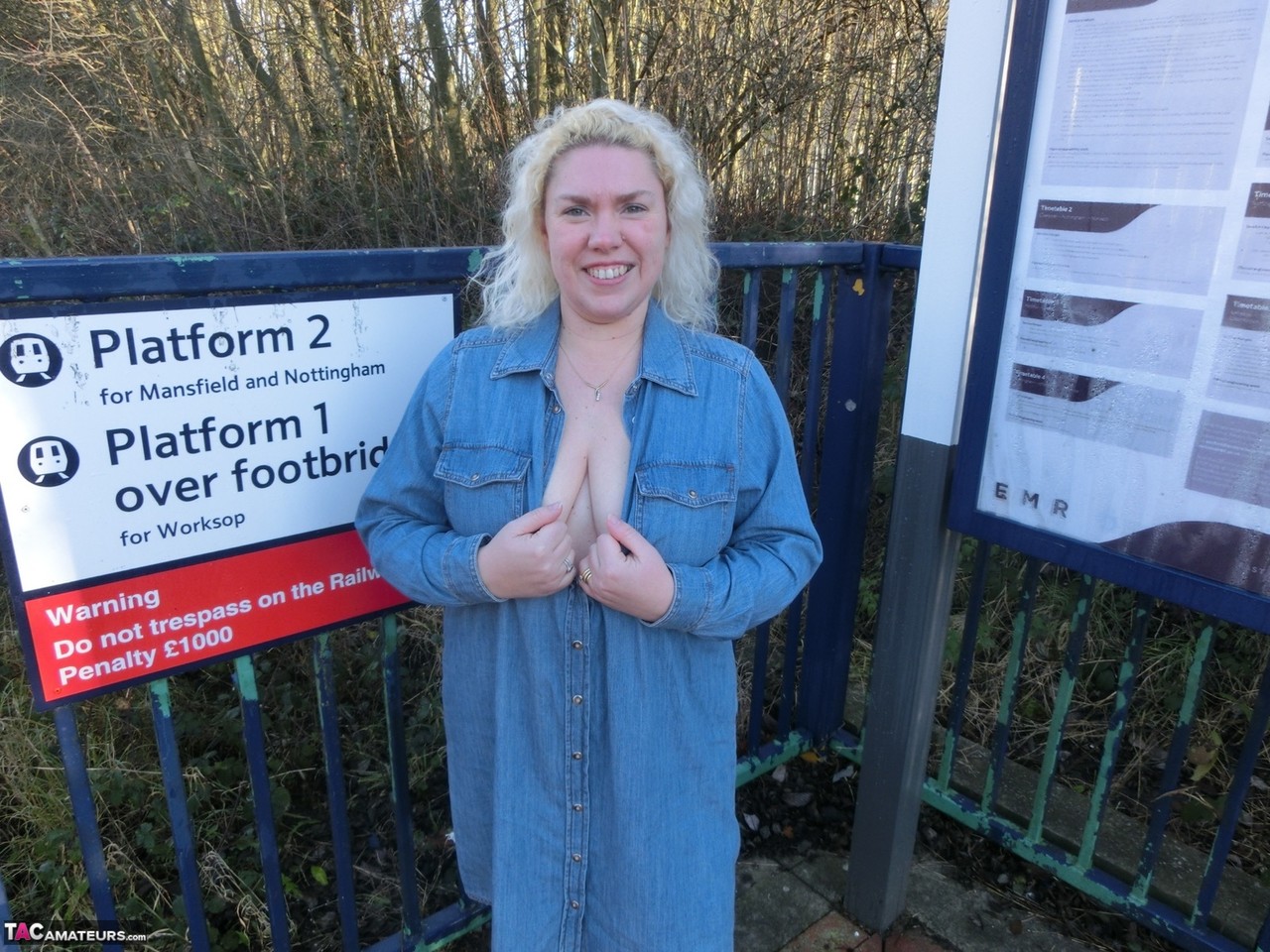 Older blonde Barby exposes her tits and pussy on a train station platform photo porno #426511892